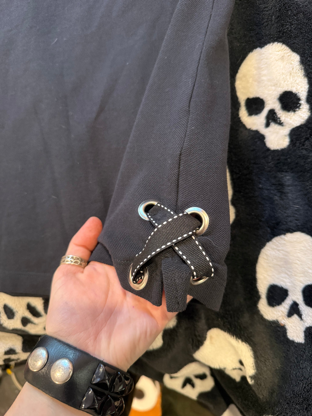 black polka dot skull polo size m