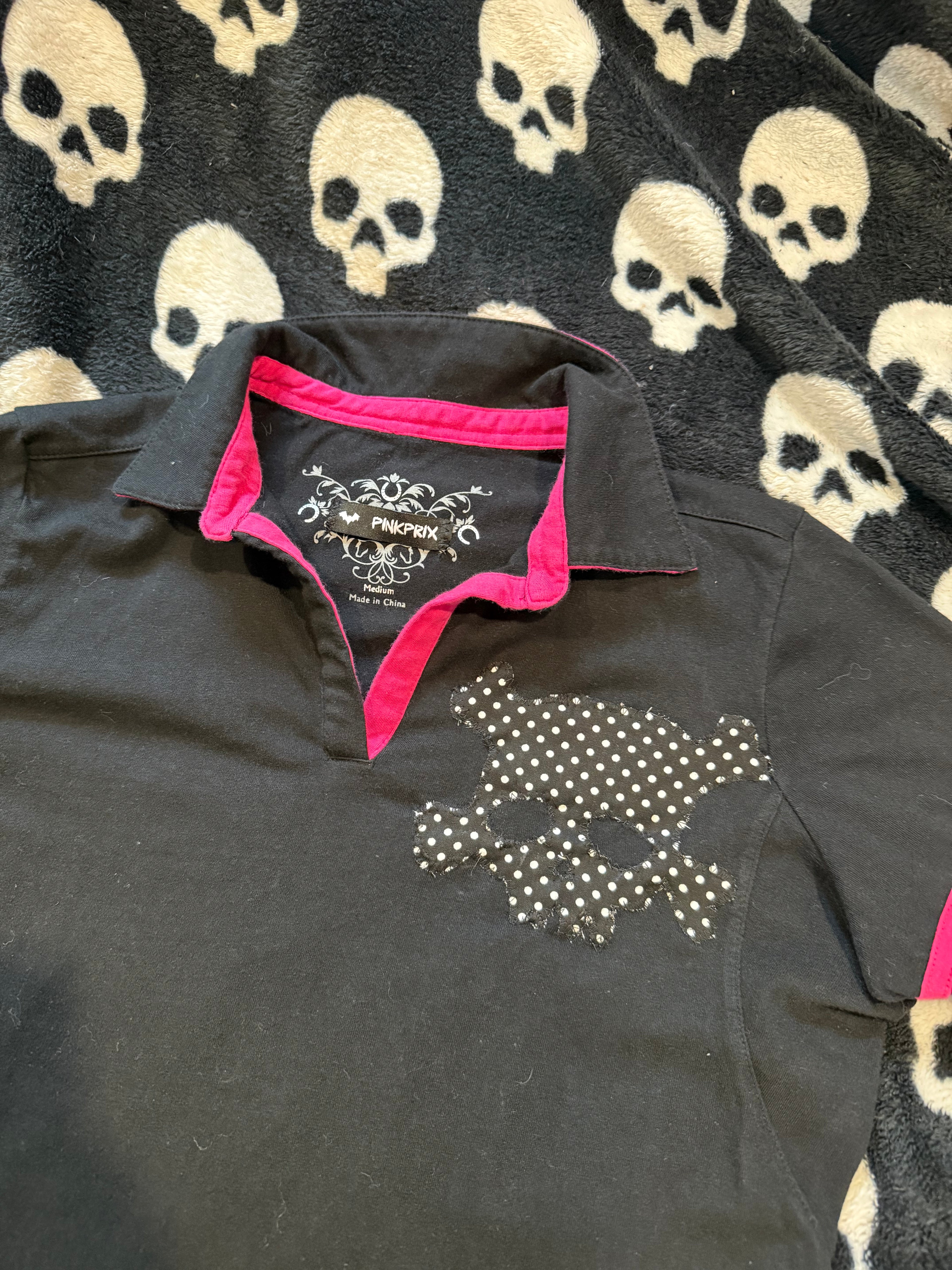 pink & black polka dot skull lace up polo size m