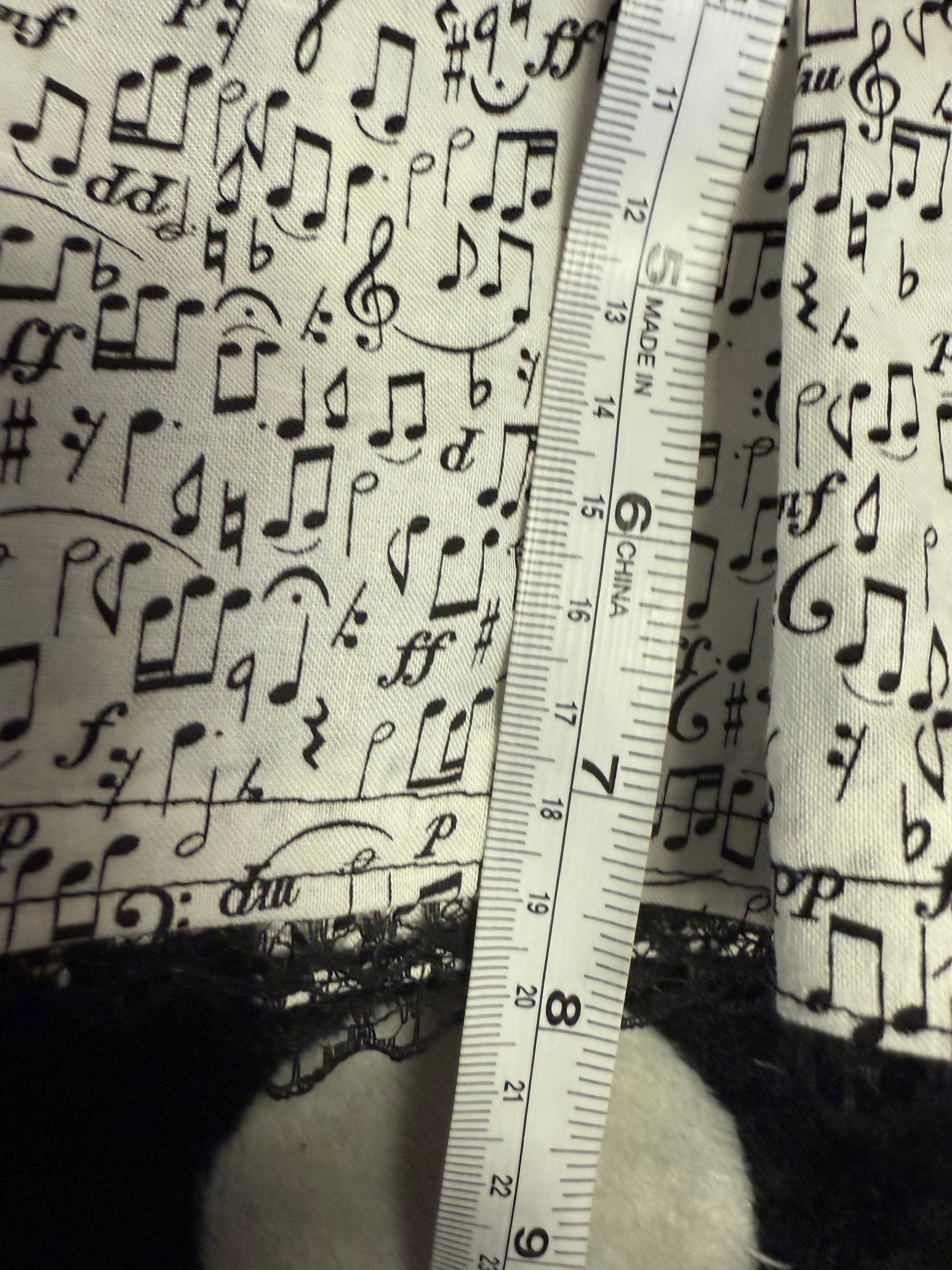 music note lace up mini skirt size m
